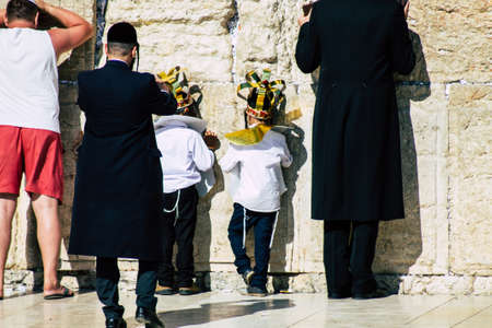 Jerusalem Israel July 3, 2019 View of young Israeli kid praying at the Western wall in the Old city of Jerusalem in the afternoonのeditorial素材