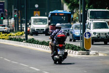 Limassol Cyprus May 21, 2020 View of unidentified people rolling with a scooter in the streets of Limassolの写真素材