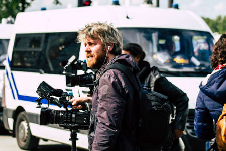 Paris France May 11, 2019 View of press journalist covering protests of the Yellow Jackets against the policy of President Macron in Paris on saturday afternoonのeditorial素材