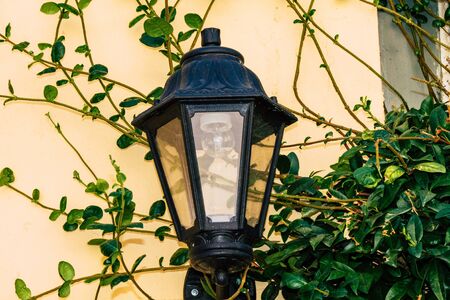 Athens Greece September 12, 2019 Closeup of a lamppost on the facade of a house in the Plaka...