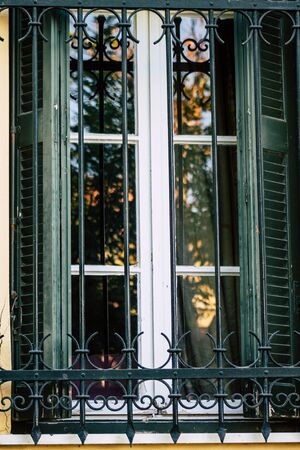 Athens Greece September 4, 2019 View of colorful window on a facade of a building in the Plaka neighborhood in the late afternoonの写真素材