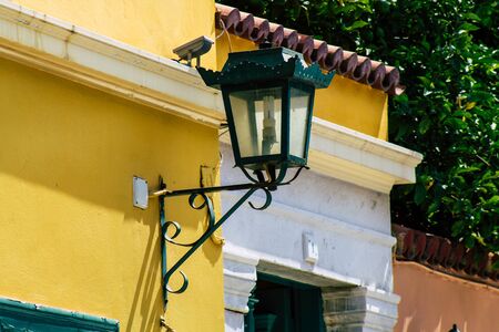 Athens Greece September 12, 2019 Closeup of a lamppost on the facade of a house in the Plaka neighborhood in the afternoonの写真素材