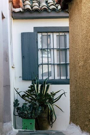 Athens Greece September 4, 2019 View of colorful window on a facade of a building in the Plaka neighborhood in the late afternoonの写真素材
