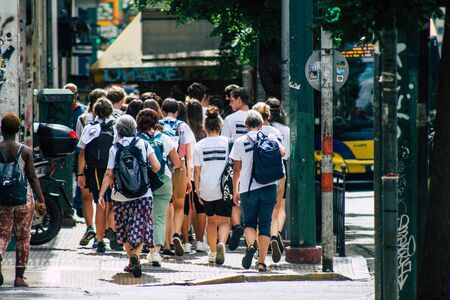 Athens Greece September 11, 2019 View of a unknowns people walking in the streets of Athens in the morningの写真素材