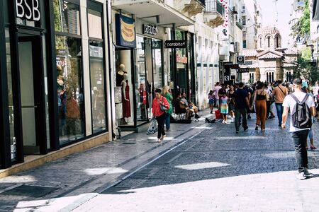 Athens Greece August 29, 2019 View of unknowns people walking and shopping at Ermou street in Athens in the afternoonの写真素材