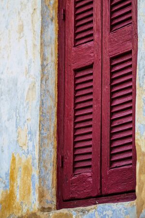Athens Greece September 4, 2019 View of colorful window on a facade of a building in the Plaka neighborhood in the late afternoonの写真素材