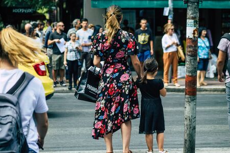 Athens Greece September 11, 2019 View of a unknowns people walking in the streets of Athens in the morningの写真素材
