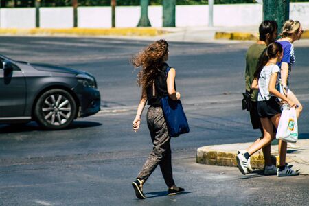 Athens Greece September 5, 2019 View of a unknowns people walking in the streets of Athens in the morningの写真素材