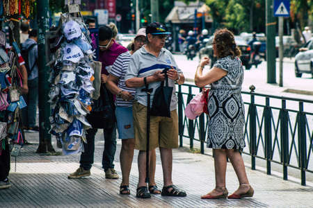 Athens Greece September 11, 2019 View of a unknowns people walking in the streets of Athens in the morningのeditorial素材