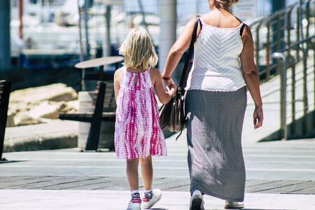 Limassol Cyprus May 28, 2020 View of unidentified young girl walking in the streets of Limassol in...