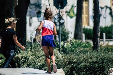 Limassol Cyprus May 28, 2020 View of unidentified young girl walking in the streets of Limassol in Cyprus islandの写真素材