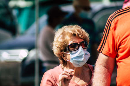 Limassol Cyprus May 23, 2020 Portrait of an unidentified people with a face mask to protect themselves from the coronavirus shopping at the Limassol market in the morningのeditorial素材