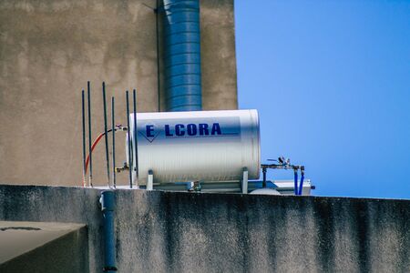 Limassol Cyprus May 30, 2020 View of a water tank from a solar stove on the roof of a building in the streets of Limassol in Cyprus islandの写真素材