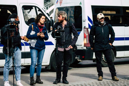 Paris France May 11, 2019 View of press journalist covering protests of the Yellow Jackets against...