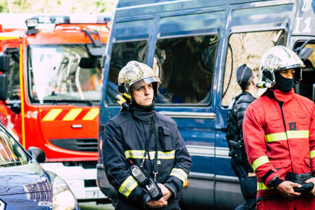 Paris France May 04, 2019 View of a French firefighters walking in the street during protests of the Yellow jackets against the policy of President Macron in Paris on saturday afternoonのeditorial素材