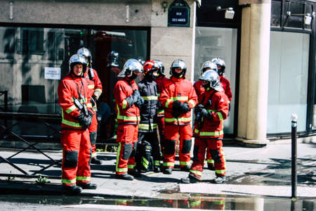 Paris France May 04, 2019 View of a French firefighters walking in the street during protests of the Yellow jackets against the policy of President Macron in Paris on saturday afternoonのeditorial素材