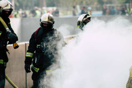 Reims France May 18, 2019 View of firefighters extinguishing a construction hut burned by rioters during protests of the Yellow Jackets in the streets of Reims on saturday afternoonのeditorial素材