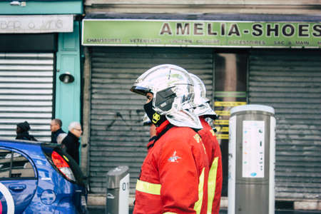 Paris France May 04, 2019 View of a French firefighters walking in the street during protests of the Yellow jackets against the policy of President Macron in Paris on saturday afternoonのeditorial素材