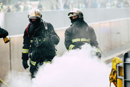 Reims France May 18, 2019 View of firefighters extinguishing a construction hut burned by rioters during protests of the Yellow Jackets in the streets of Reims on saturday afternoonのeditorial素材
