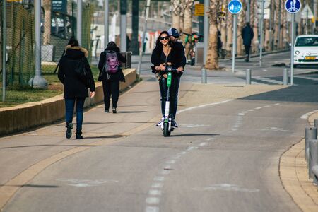 Tel Aviv Israel December 25, 2019 View of unidentified people rolling with a electric scooter in the...
