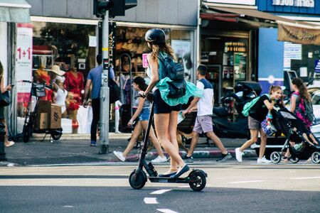 Tel Aviv Israel June 17, 2019 View of unknown Israeli people rolling with a electric scooter in the...