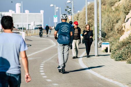 Tel Aviv Israel December 22, 2019 View of unidentified people rolling with a electric scooter in the...
