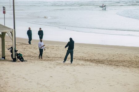 Tel Aviv Israel February 22, 2020 View of unidentified Israeli people having fun on the beach of Tel Aviv in winterの写真素材