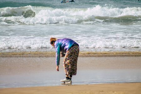 Tel Aviv Israel February 22, 2020 View of unidentified Israeli people having fun on the beach of Tel Aviv in winterの写真素材