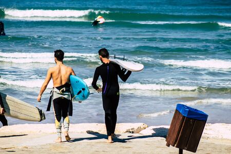 Tel Aviv Israel February 13, 2020 View of unidentified Israeli people having fun on the beach of Tel Aviv during a sunny day in winterの写真素材
