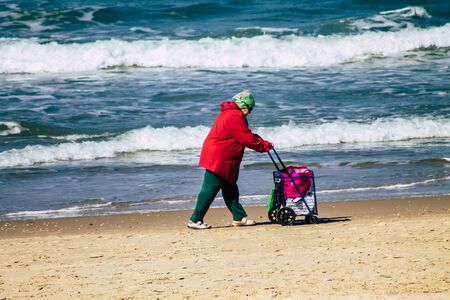 Tel Aviv Israel February 13, 2020 View of unidentified Israeli people having fun on the beach of Tel Aviv during a sunny day in winterの写真素材