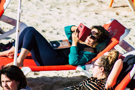 Tel Aviv Israel February 15, 2020 View of unidentified Israeli people having fun on the beach of Tel Aviv during a sunny day in winterのeditorial素材