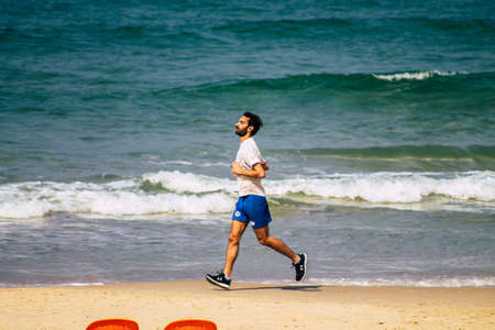 Tel Aviv Israel February 17, 2020 View of unidentified Israeli people having fun on the beach of Tel Aviv in winterのeditorial素材