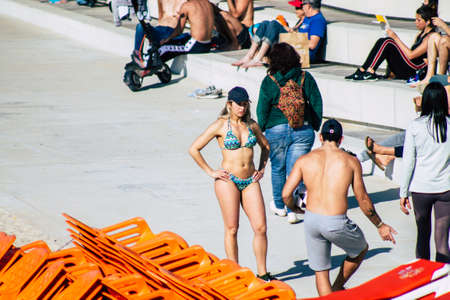 Tel Aviv Israel February 15, 2020 View of unidentified Israeli people having fun on the beach of Tel Aviv during a sunny day in winterのeditorial素材