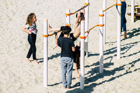 Tel Aviv Israel February 15, 2020 View of unidentified Israeli people having fun on the beach of Tel Aviv during a sunny day in winterのeditorial素材