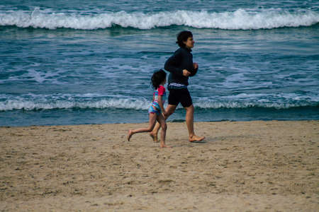 Tel Aviv Israel February 17, 2020 View of unidentified Israeli people having fun on the beach of Tel Aviv in winterのeditorial素材