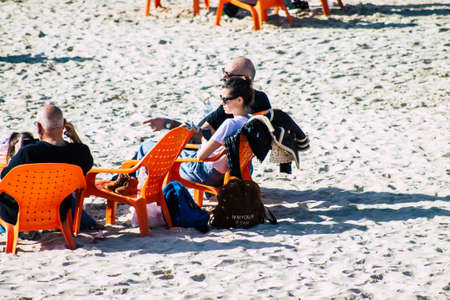 Tel Aviv Israel February 15, 2020 View of unidentified Israeli people having fun on the beach of Tel Aviv during a sunny day in winterのeditorial素材