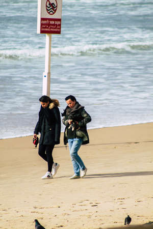 Tel Aviv Israel February 22, 2020 View of unidentified Israeli people having fun on the beach of Tel Aviv in winterのeditorial素材