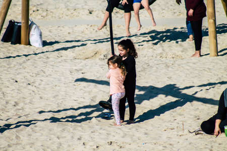 Tel Aviv Israel February 15, 2020 View of unidentified Israeli people having fun on the beach of Tel Aviv during a sunny day in winterのeditorial素材