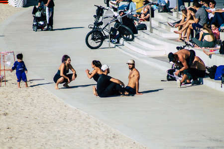 Tel Aviv Israel February 15, 2020 View of unidentified Israeli people having fun on the beach of Tel Aviv during a sunny day in winterのeditorial素材