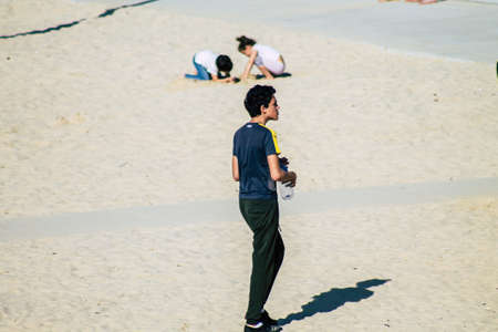 Tel Aviv Israel February 15, 2020 View of unidentified Israeli people having fun on the beach of Tel Aviv during a sunny day in winterのeditorial素材