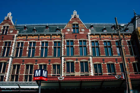 Amsterdam Netherlands April 22, 2019 View of the old Central train station located in Amsterdam during a sunny day in the eveningのeditorial素材