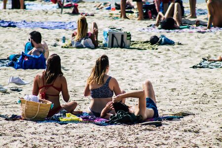 Tel Aviv Israel October 05, 2019 View of unknowns people having fun on the beach of Tel Aviv in the afternoonの写真素材