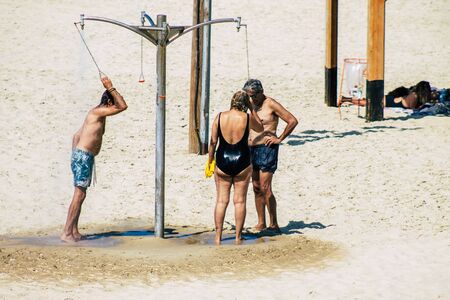 Tel Aviv Israel October 05, 2019 View of unknowns people having fun on the beach of Tel Aviv in the afternoonの写真素材