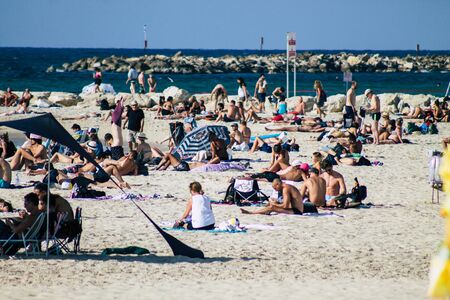 Tel Aviv Israel October 08, 2019 View of unknowns people having fun on the beach of Tel Aviv in the afternoonの写真素材