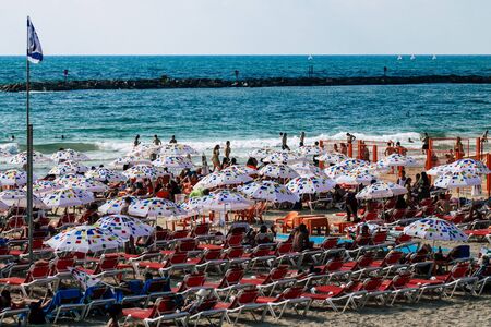 Tel Aviv Israel July 23, 2019 View of unknown Israeli people having fun on the beach of Tel Aviv during a sunny day in the afternoonの写真素材