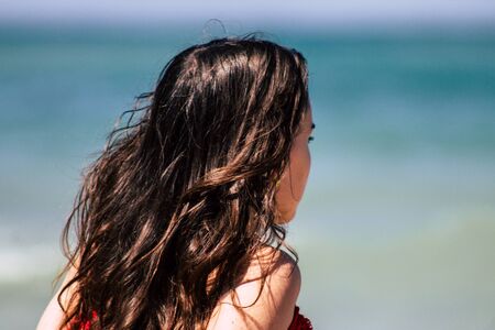 Tel Aviv Israel July 6, 2019 View of unknown teen having fun on the beach of Tel Aviv during a sunny day in the afternoonの写真素材