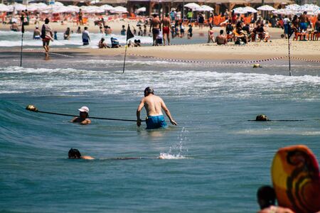 Tel Aviv Israel August 20, 2019 View of unknown Israeli people having fun on the beach of Tel Aviv...