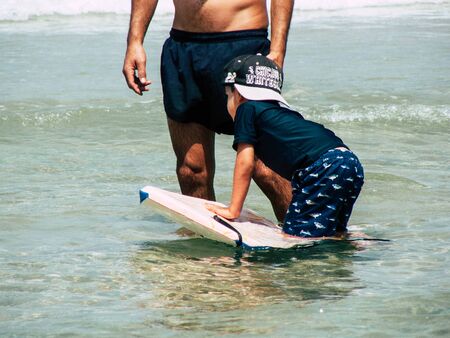Tel Aviv Israel June 9, 2019 View of unknown Israeli children having fun on the beach of Tel Aviv in the afternoonの写真素材