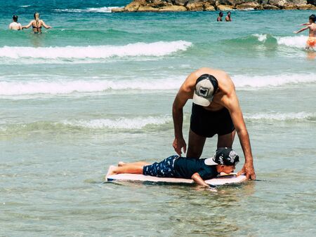 Tel Aviv Israel June 9, 2019 View of unknown Israeli children having fun on the beach of Tel Aviv in the afternoonの写真素材