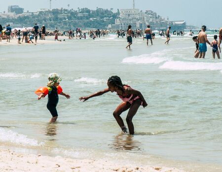Tel Aviv Israel June 9, 2019 View of unknown Israeli children having fun on the beach of Tel Aviv in the afternoonの写真素材